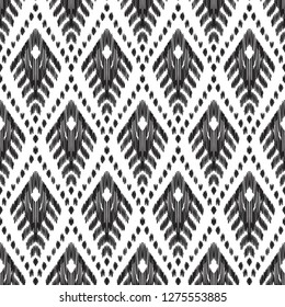 Ethnic seamless pattern. Boho ikat ornament. Can be used for textile, wallpaper, wrapping paper, greeting card background, phone case print. Black and white vector illustration. Tribal graphic design.