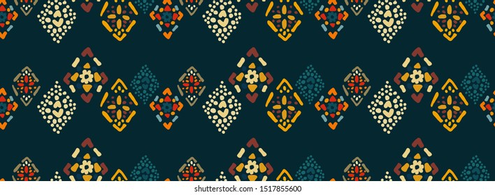Ethnic seamless pattern with colorful diamonds on dark blue background. Stylized mosaic folk print, texture, pattern for fashion design, interior, clothing... Vector illustration.