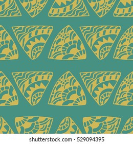 Ethnic seamless pattern of doodle yellow triangles on green background. Tribal background. Infinity hand drawn geometric wrapping paper. Vector illustration.