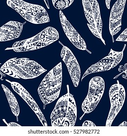 Ethnic seamless pattern with feathers. Decorative geometric elements. Retro hand drawings. Vector illustration.