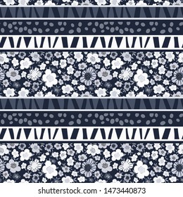 Ethnic seamless pattern with floral stripes and decorative geometric elements. Abstract vintage print in monochrome (black and white) colors. Folk ornament. Retro template for fashion prints. Vector.