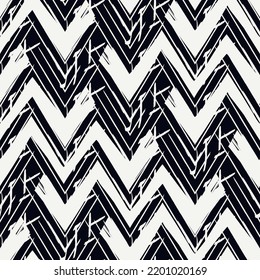 Ethnic seamless pattern. Freehand zigzag stripes print. Boho chic design background. Tribal style wallpaper. Brush wavy lines. Handdrawn geometric ornament. Chevron backdrop. Indigenous image