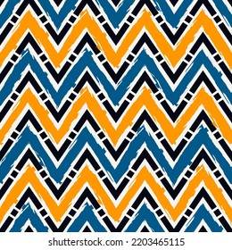 Ethnic seamless pattern. Freehand zigzag stripes print. Boho chic design background. Tribal wallpaper. Brush wavy lines. Handdrawn geometric ornament. Chevron backdrop. Indigenous image