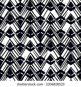 Ethnic seamless pattern. Freehand zigzag stripes print. Boho chic design background. Tribal wallpaper. Brush wavy lines. Handdrawn geometric ornament. Chevron backdrop. Indigenous image. Vector art.
