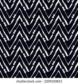 Ethnic seamless pattern. Freehand zigzag stripes print. Boho chic design background. Tribal wallpaper. Brush wavy lines. Handdrawn geometric ornament. Chevron backdrop. Indigenous image