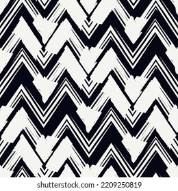 Ethnic seamless pattern. Freehand zigzag stripes print. Boho chic design background. Tribal style wallpaper. Brush wavy lines. Handdrawn geometric ornament. Chevron backdrop. Indigenous image.