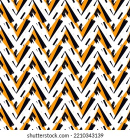 Ethnic seamless pattern. Freehand zigzag stripes print. Boho chic design background. Tribal wallpaper. Brush wavy lines. Handdrawn geometric ornament. Chevron backdrop. Indigenous image