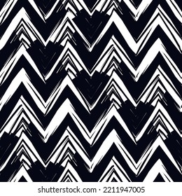 Ethnic seamless pattern. Freehand zigzag stripes print. Boho chic design background. Tribal wallpaper. Brush wavy lines. Handdrawn geometric ornament. Chevron backdrop. Indigenous image. Vector art.