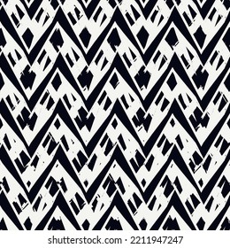 Ethnic seamless pattern. Freehand zigzag stripes print. Boho chic design background. Tribal style wallpaper. Brush wavy lines. Handdrawn geometric ornament. Chevron backdrop. Indigenous image.