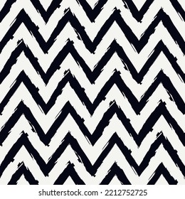 Ethnic seamless pattern. Freehand zigzag stripes print. Boho chic design background. Tribal style wallpaper. Brush wavy lines. Handdrawn geometric ornament. Chevron backdrop. Indigenous image