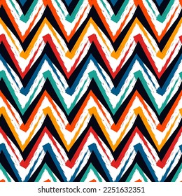 Ethnic seamless pattern. Freehand zigzag stripes print. Boho chic design background. Tribal style wallpaper. Brush wavy lines. Handdrawn geometric ornament. Chevron backdrop. Indigenous image