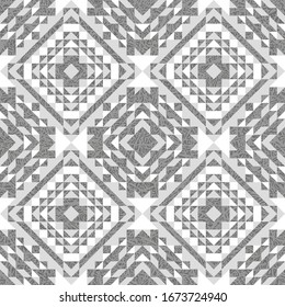 Patrón étnico sin fisuras de formas geométricas en un fondo texturado. Grados monocromos.