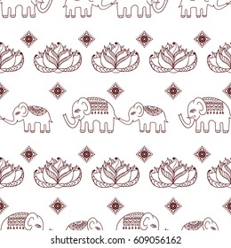 Ethnic seamless pattern with mom and baby elephants. Indian native background. Henna mehndi print design.