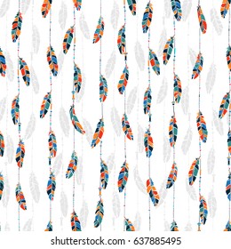 Ethnic seamless pattern in native style with bright colored feathers and beads against white background