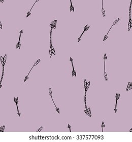 Ethnic seamless pattern. Texture with tribal hand drawn arrows. Native american design. Backdrop with vintage arrows. Black doodle elements on the purple background. Vector illustration.
