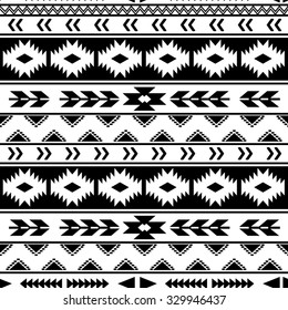 Ethnic seamless pattern. Tribal seamless texture. Aztec tribal seamless white pattern on black background.