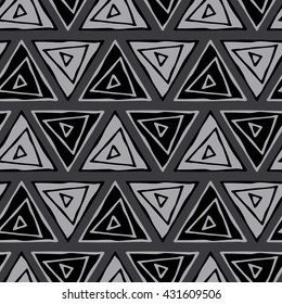 Ethnic seamless pattern. Tribal triangles seamless gray background