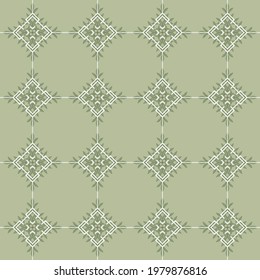 Ethnic seamless vector pattern with botanical squares ornament. Rhombus and leaves on laurel green background color. Traditional folk motif. Great for fabric, wrapping paper, interior decor.