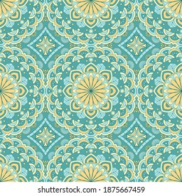 Ethnic seamless vector pattern. Green and yellow geometric flower. Can be used for design of fabric, covers, wallpapers, tiles.
