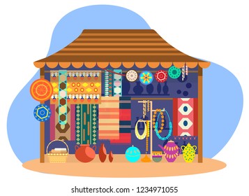 Ethnic souvenir street shop. Street store with carpets, mats, ceramics, pottery and jewelry.