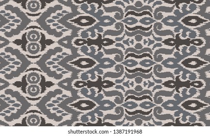 Ethnic style seamless pattern with ikat stylized ornament. Traditional ornamental textile design. Folklore handicraft repeating background.