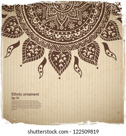 Ethnic sun ornament on the Cardboard background