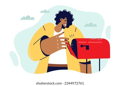 Ethnic woman opens street mailbox, checking for fresh mail and letters or newspapers. Happy African American lady stands outdoors near mailbox and looks inside with smile, looking for envelope.