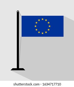 eu flag on pole, isolated on gray background