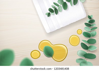 Eucalyptus branch and oil stain on wooden table with rolled tower. Spilled liquid for skincare and fabric for shower with aromatherapy plant branch. Shower and hygiene, spa salon and bathroom theme
