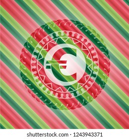 euro icon inside christmas style emblem.