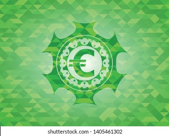 euro icon inside green emblem with triangle mosaic background