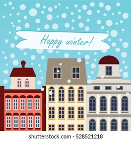 European buildings with snow and "Happy winter" text. Good for cards and invitation.