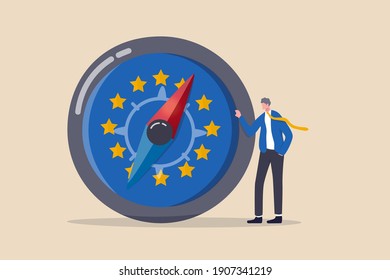 European Union economic direction after Brexit and COVID-19, EU financial strategy or business and stock market outlook concept, businessman leader standing with direction compass with Euro zone flag.