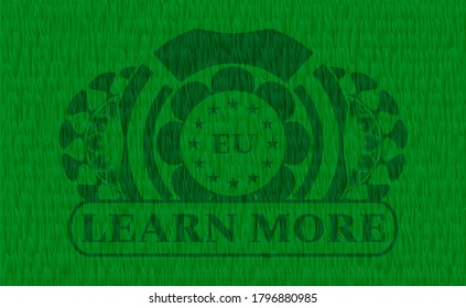 european union icon and Learn more text green pasture grass realistic badge. Eco chic background. Artistic illustration. 