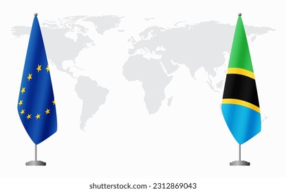European Union and Tanzania flags for official meeting against background of world map.
