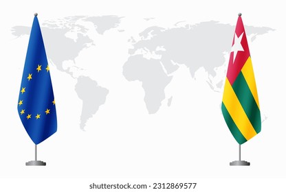 European Union and Togo flags for official meeting against background of world map.