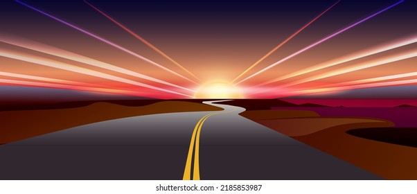 Evening landscape with the road and the rays of the setting sun
