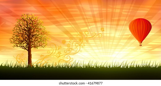 Evening summer landscape with a lonely tree and a red hot air balloon
