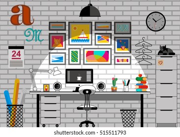 Evening workspace with computer, colorful books, a flowering cactus and a lamp on the table