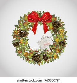 evergreen christmas wreath with apples cones holly and bow 