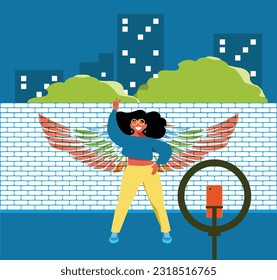 Everyday Inclusion: Embracing Diversity in Daily Life - Latina Urban Style: Girl Posing for Selfie or Live Stream in Front of Graffiti Wings