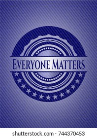 Everyone Matters badge with jean texture