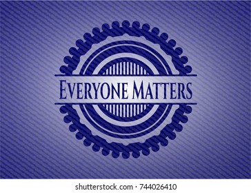Everyone Matters emblem with jean texture