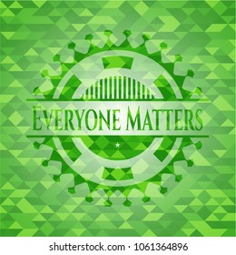 Everyone Matters green emblem with triangle mosaic background