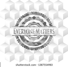 Everyone Matters grey badge with geometric cube white background