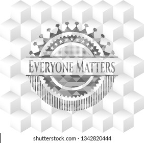 Everyone Matters grey emblem with geometric cube white background