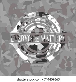 Everyone Matters written on a grey camouflage texture