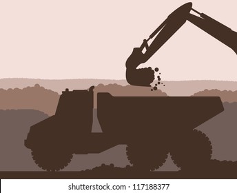 Excavator loader at building site with raised bucket and truck