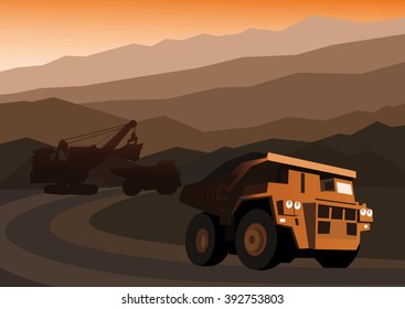 Excavator pours coal into the trucks in the open pit coal mine.