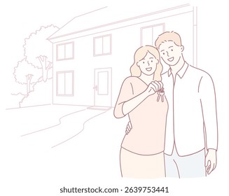An excited couple joyfully celebrates their new home ownership by proudly holding up their house keys